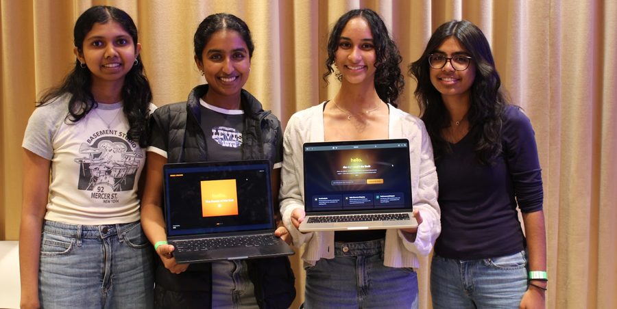 Four students holding laptops at Sodahacks